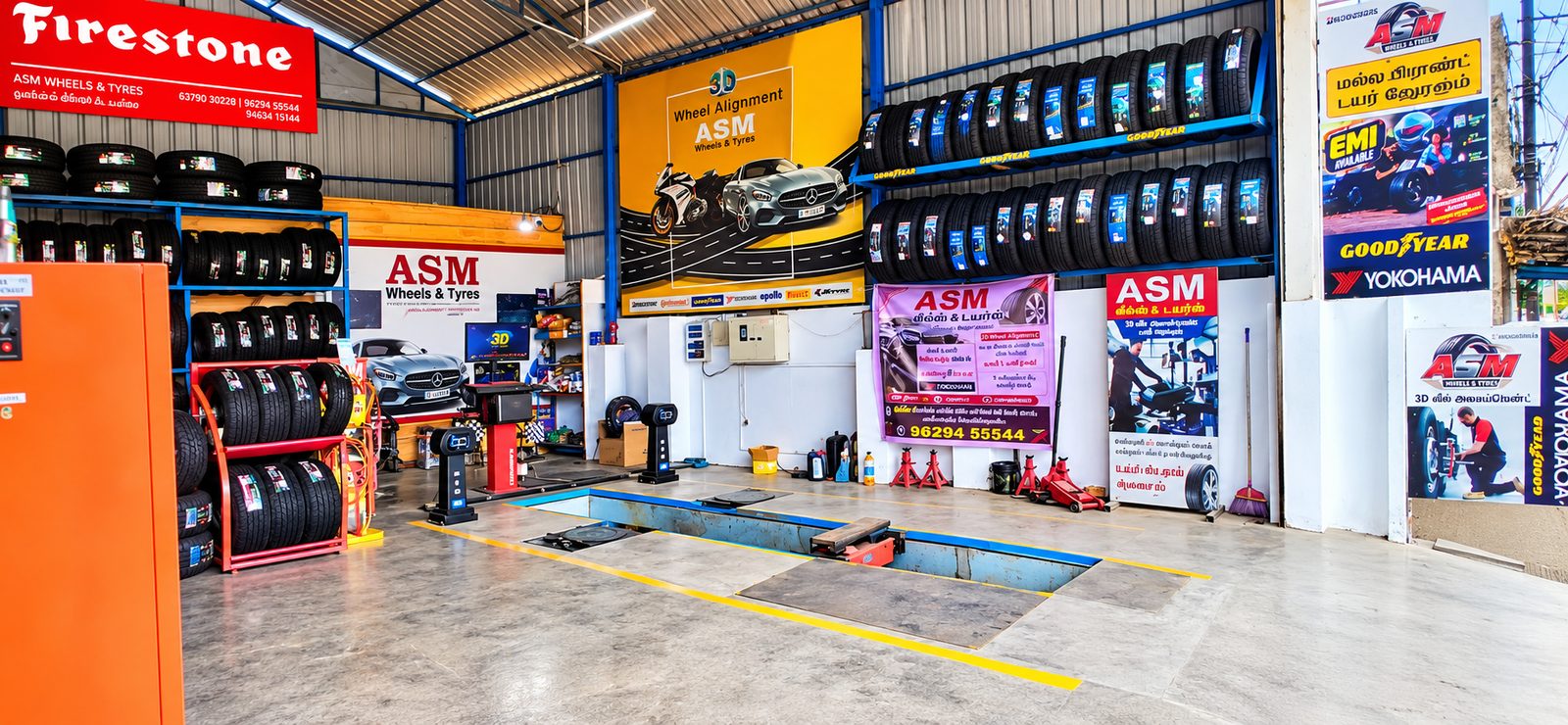 Inside the ASM Wheels & Tyres showroom — alignment bay and tyre racks